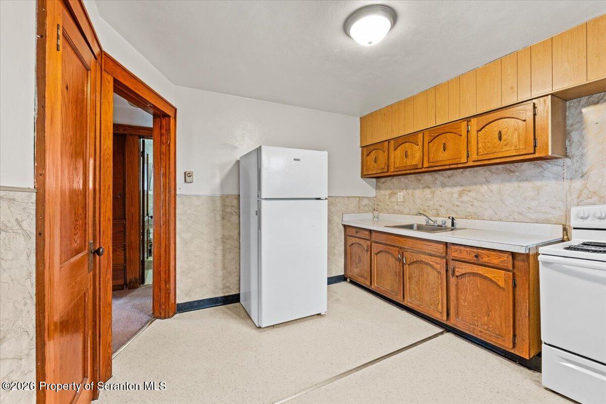 622 East Market Street Scranton, PA 18509 - Photo 25 of 44 a kitchen with stainless steel appliances granite countertop a refrigerator a stove and a sink