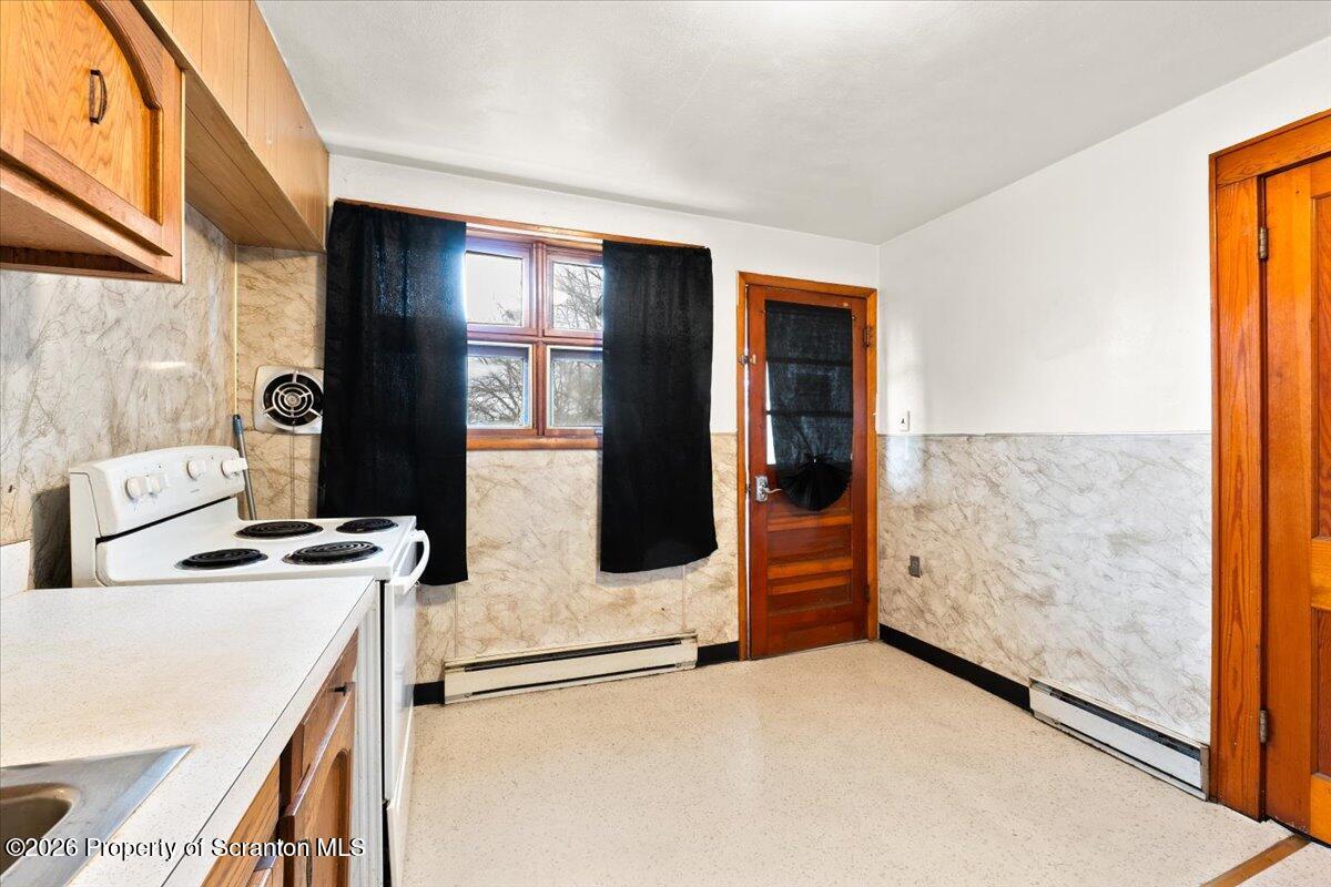 622 East Market Street Scranton, PA 18509 - Photo 26 of 44 a kitchen with a stove and a refrigerator