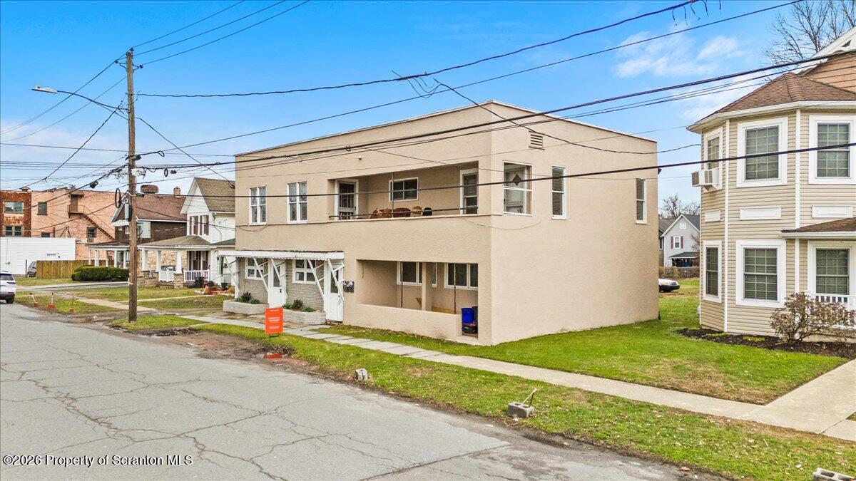 622 East Market Street Scranton, PA 18509 - Photo 3 of 44 a front view of a house with a yard