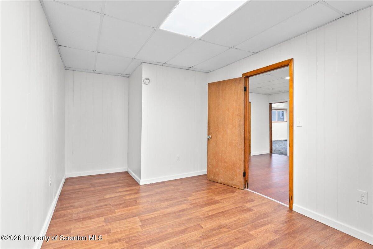 622 East Market Street Scranton, PA 18509 - Photo 43 of 44 an empty room with wooden floor and sliding door