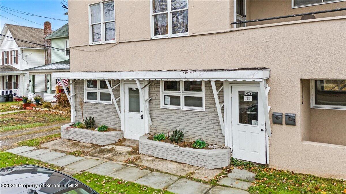622 East Market Street Scranton, PA 18509 - Photo 6 of 44 a front view of a building with table and chair
