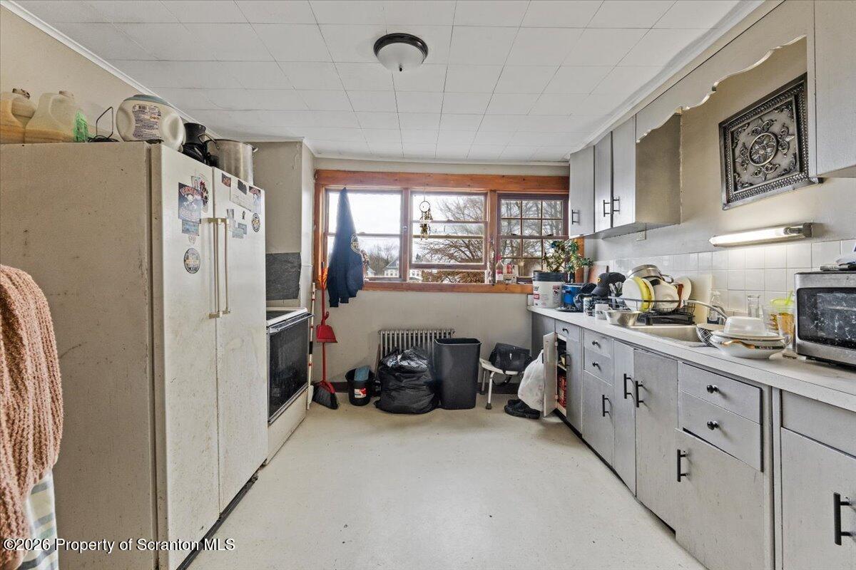 622 East Market Street Scranton, PA 18509 - Photo 9 of 44 a kitchen with refrigerator a sink and cabinet