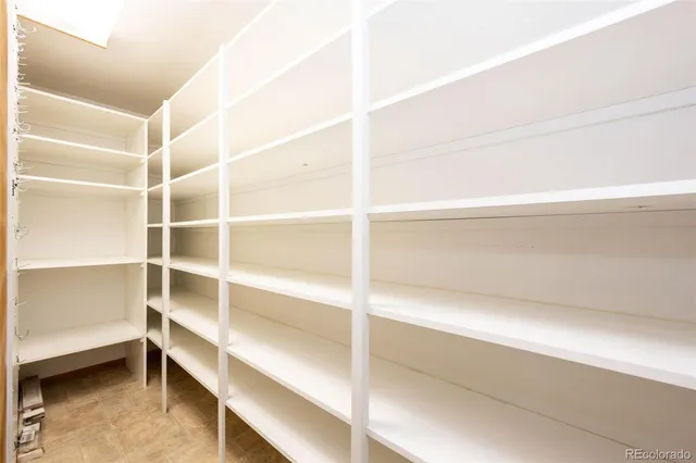 a kitchen with a sink stove top oven and refrigerator