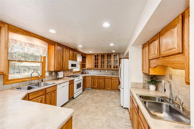 a view of a livingroom with a ceiling fan and window