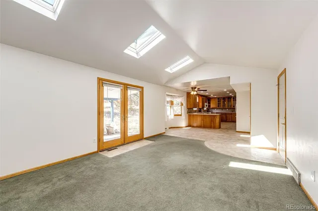 a bathroom with a sink mirror and toilet