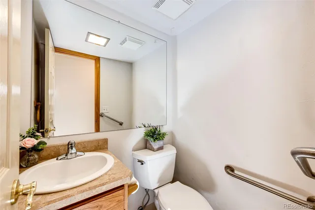 a view of a livingroom with a ceiling fan and window