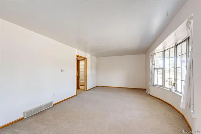 an empty room with windows