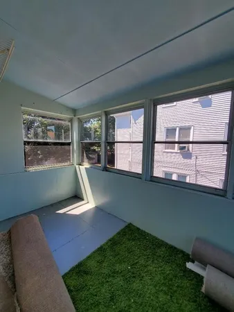 a bedroom with window and gate