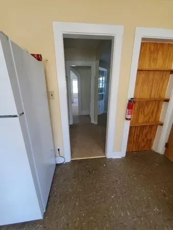 a bathroom with a tub and toilet