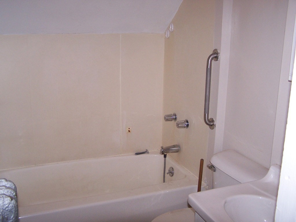 163 New Boston Road, Unit 2 Fall River, MA 02720 - Photo 7 of 15 a bathroom with a tub and toilet