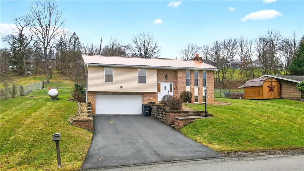 a front view of a house with a yard