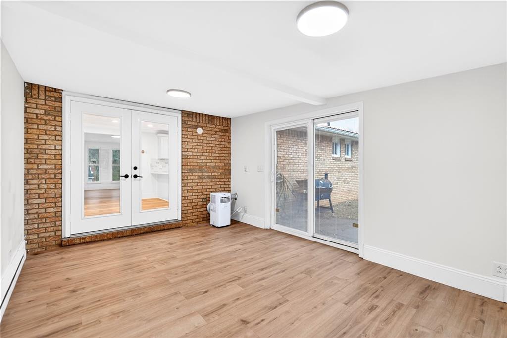 3 Park Road Charleroi, PA 15022 - Photo 16 of 43 a view of an empty room with wooden floor and a window