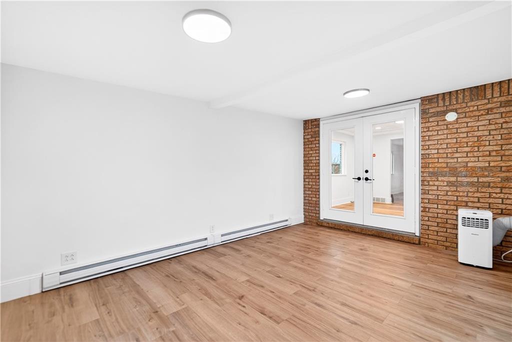 3 Park Road Charleroi, PA 15022 - Photo 17 of 43 a view of an empty room with wooden floor and a window