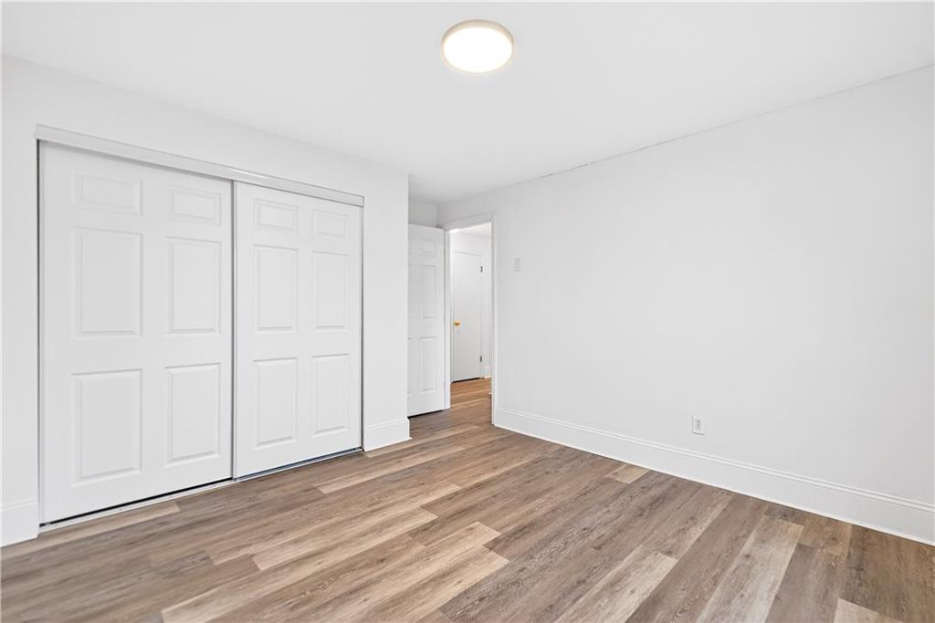 3 Park Road Charleroi, PA 15022 - Photo 21 of 43 an empty room with wooden floor and windows