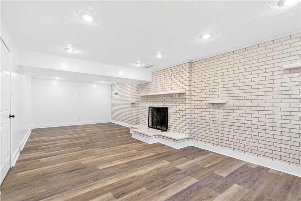 3 Park Road Charleroi, PA 15022 - Photo 27 of 43 a view of an empty room with wooden floor and a fireplace