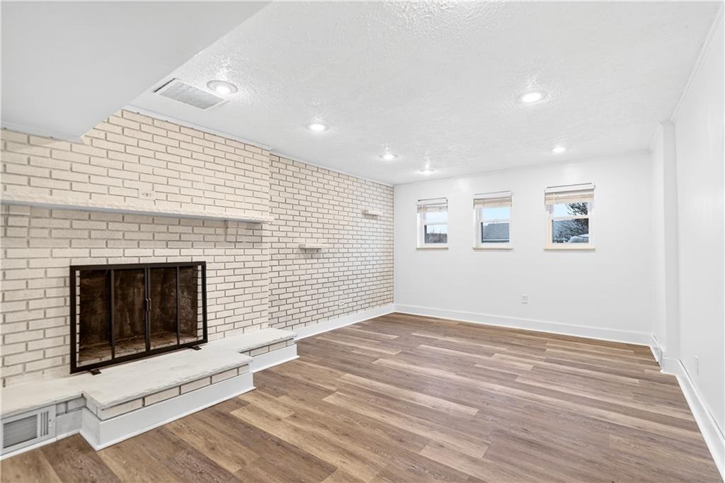 3 Park Road Charleroi, PA 15022 - Photo 29 of 43 a view of an empty room with wooden floor and fireplace
