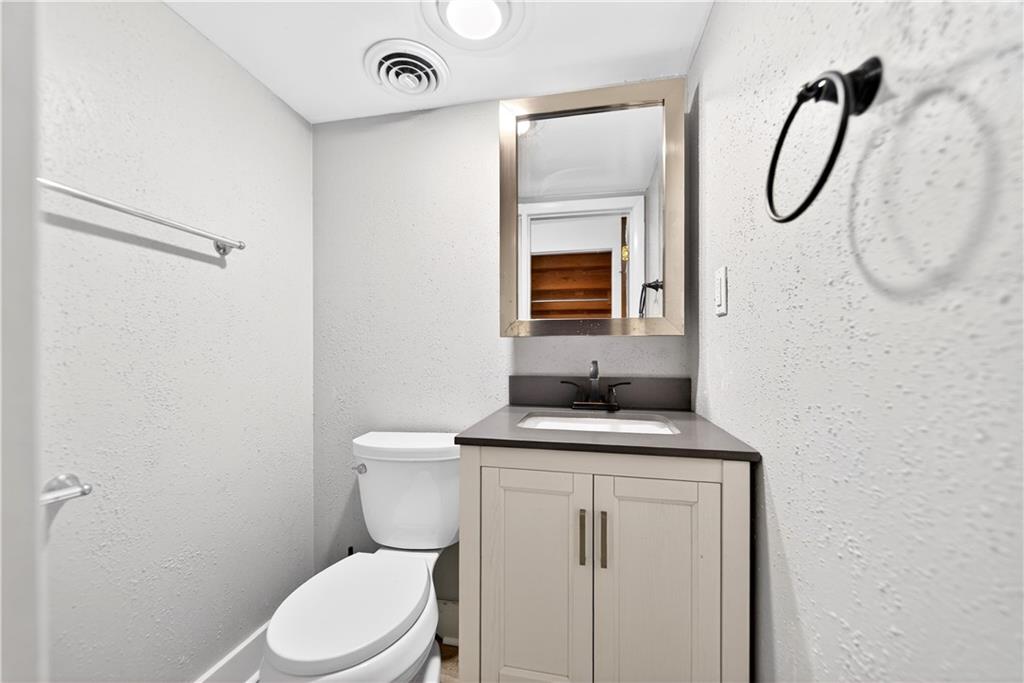 3 Park Road Charleroi, PA 15022 - Photo 33 of 43 a bathroom with a granite countertop toilet sink and mirror