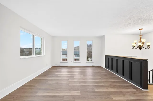 a view of a livingroom with wooden floor