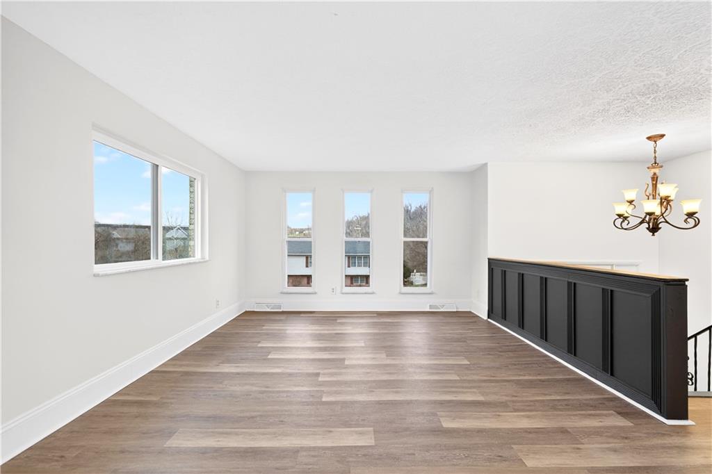 3 Park Road Charleroi, PA 15022 - Photo 4 of 43 a view of an empty room with wooden floor and a window