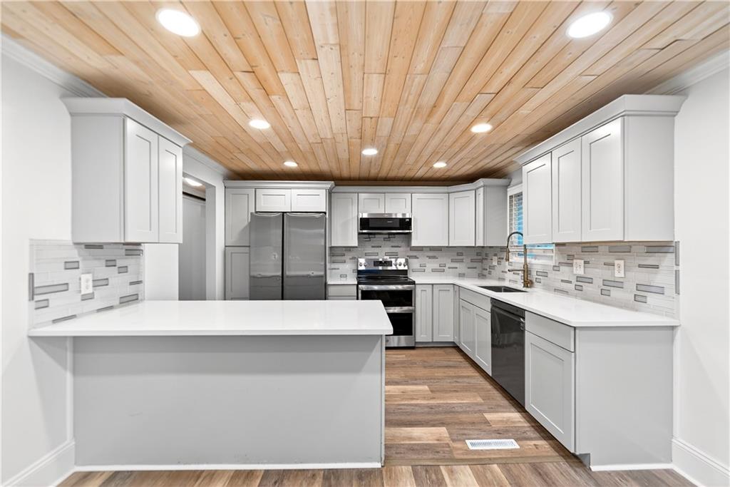3 Park Road Charleroi, PA 15022 - Photo 9 of 43 a large kitchen with a large counter top stainless steel appliances and cabinets