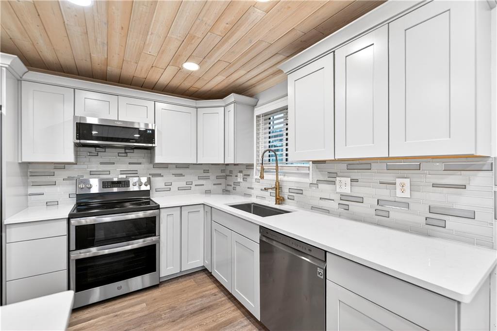 3 Park Road Charleroi, PA 15022 - Photo 10 of 43 a kitchen with kitchen island granite countertop a sink stainless steel appliances and cabinets
