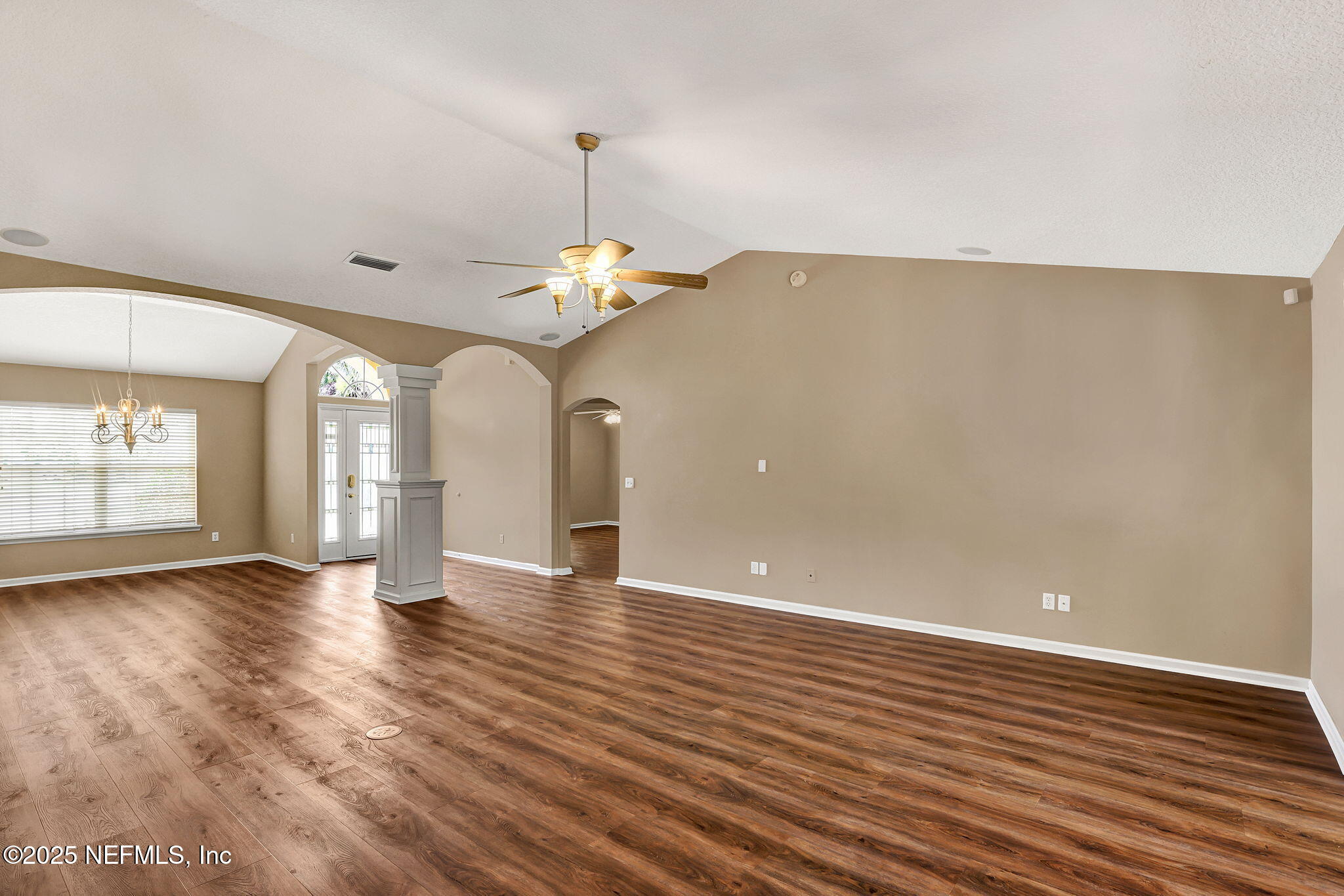 1994 Protection Point Fleming Island, FL 32003 - Photo 16 of 46 a view of an empty room with wooden floor and a window