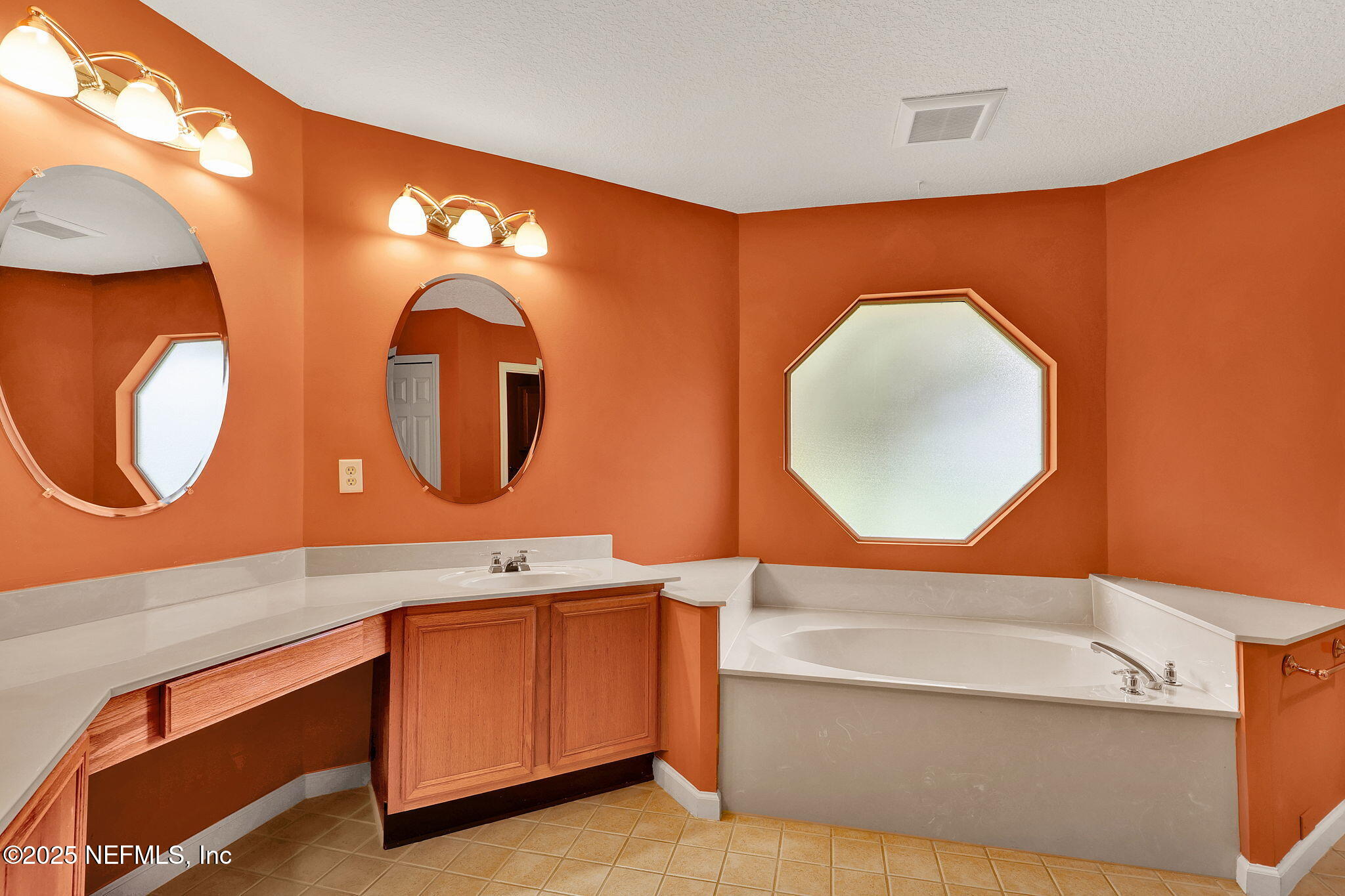 1994 Protection Point Fleming Island, FL 32003 - Photo 22 of 46 a bathroom with a sink mirror and vanity