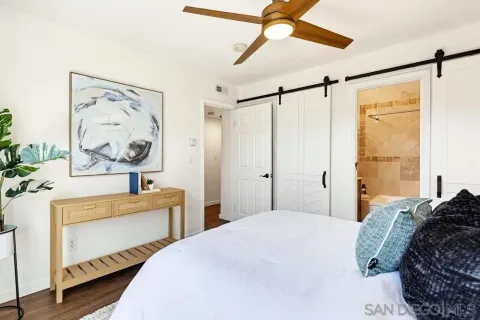 a bedroom with a bed and a dresser