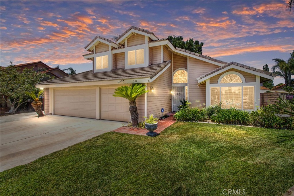 222 Bathurst Road Riverside, CA 92506 - Photo 1 of 1 a front view of a house with a yard and garage