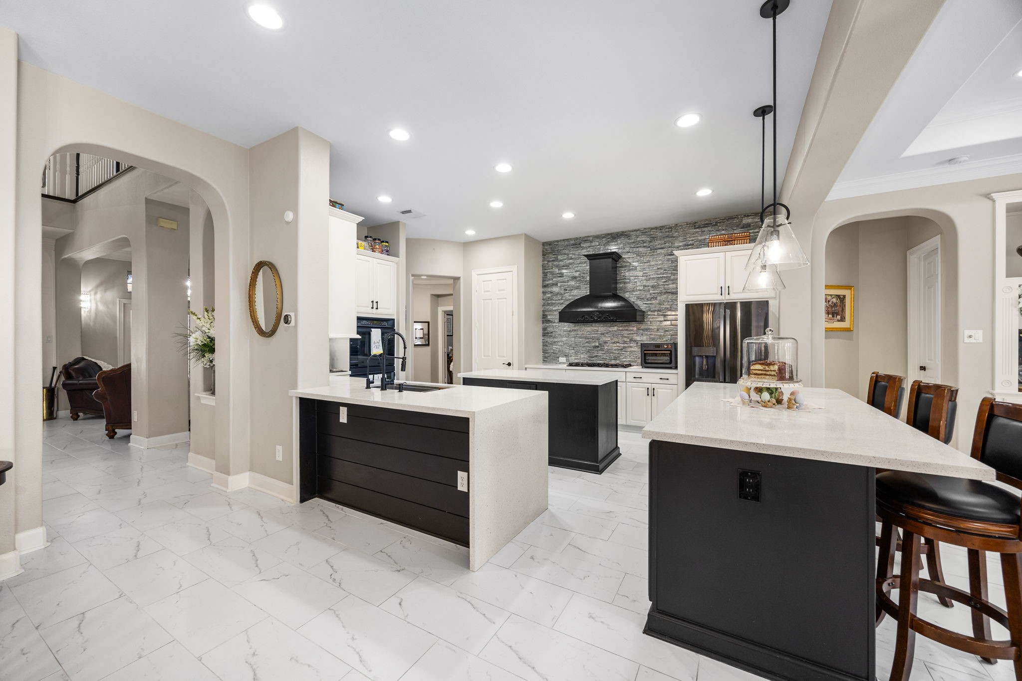 11413 Gallant Ridge Lane Houston, TX 77082 - Photo 15 of 48 a large white kitchen with a sink and refrigerator
