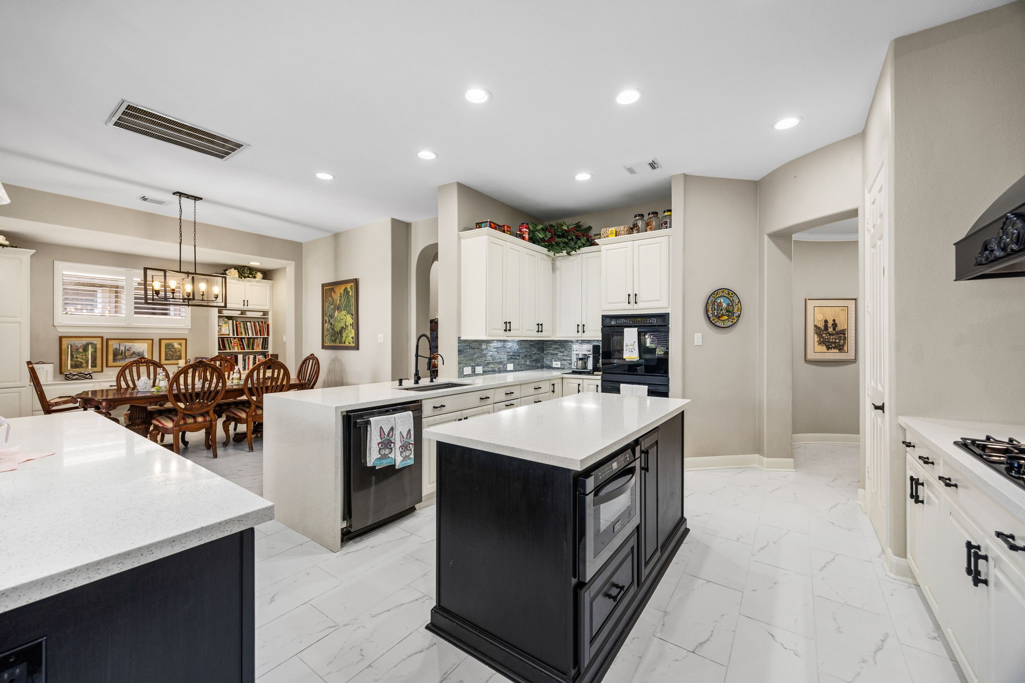 11413 Gallant Ridge Lane Houston, TX 77082 - Photo 16 of 48 a kitchen with stainless steel appliances a sink a stove a counter top space and cabinets