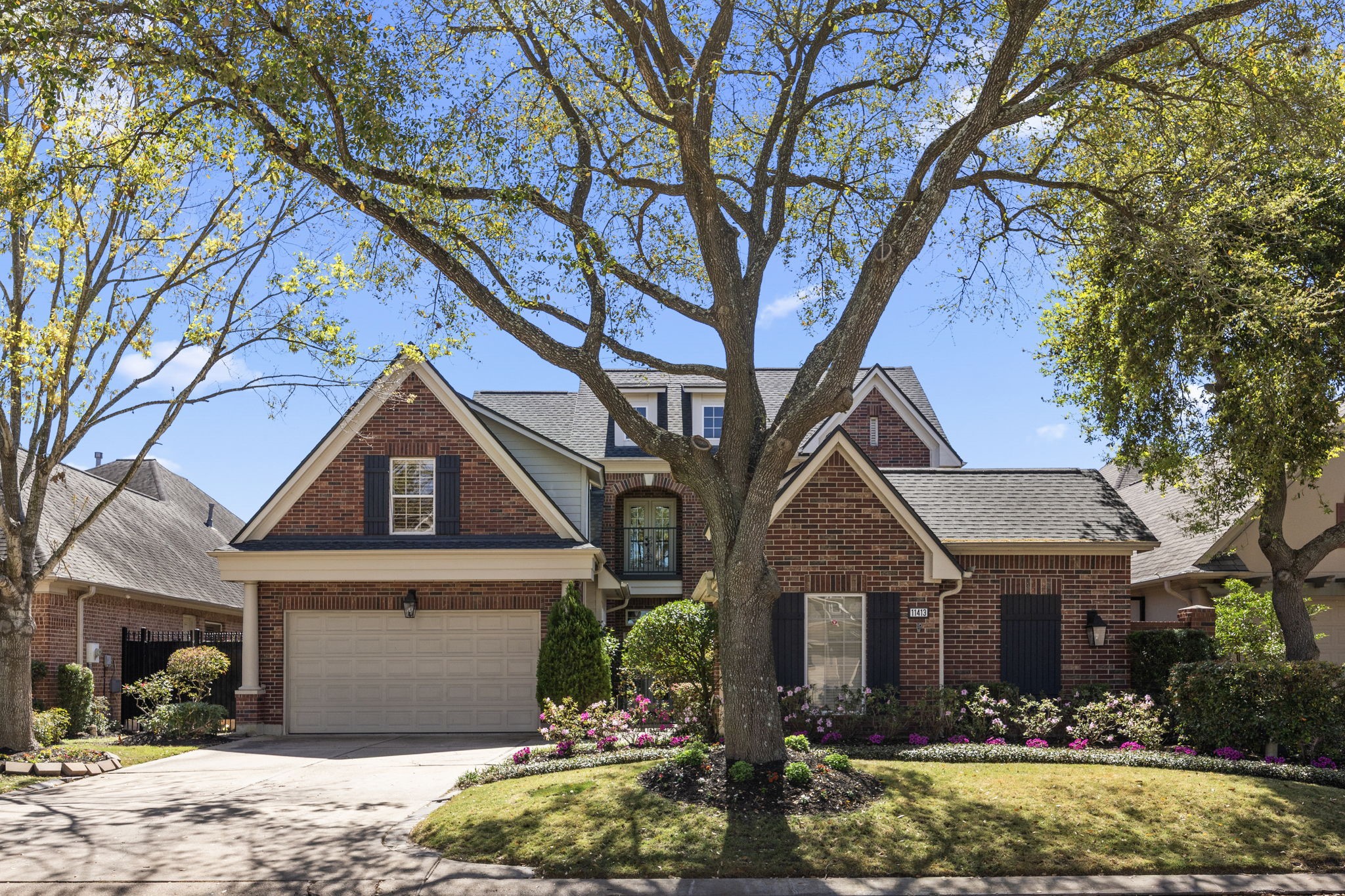 11413 Gallant Ridge Lane Houston, TX 77082 - Photo 2 of 48 a front view of a house with a yard and garage