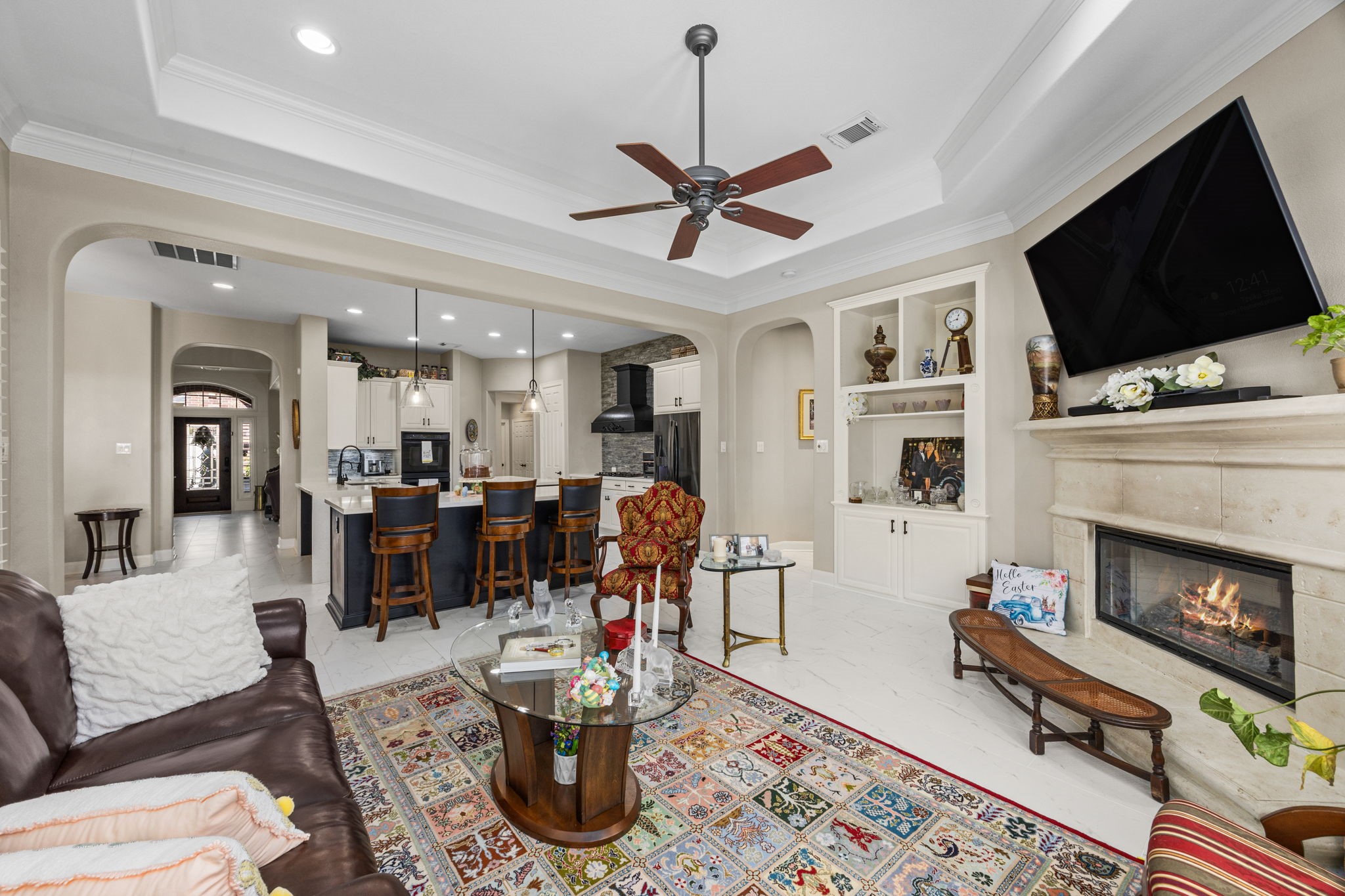11413 Gallant Ridge Lane Houston, TX 77082 - Photo 22 of 48 a living room with furniture a flat screen tv and a fireplace