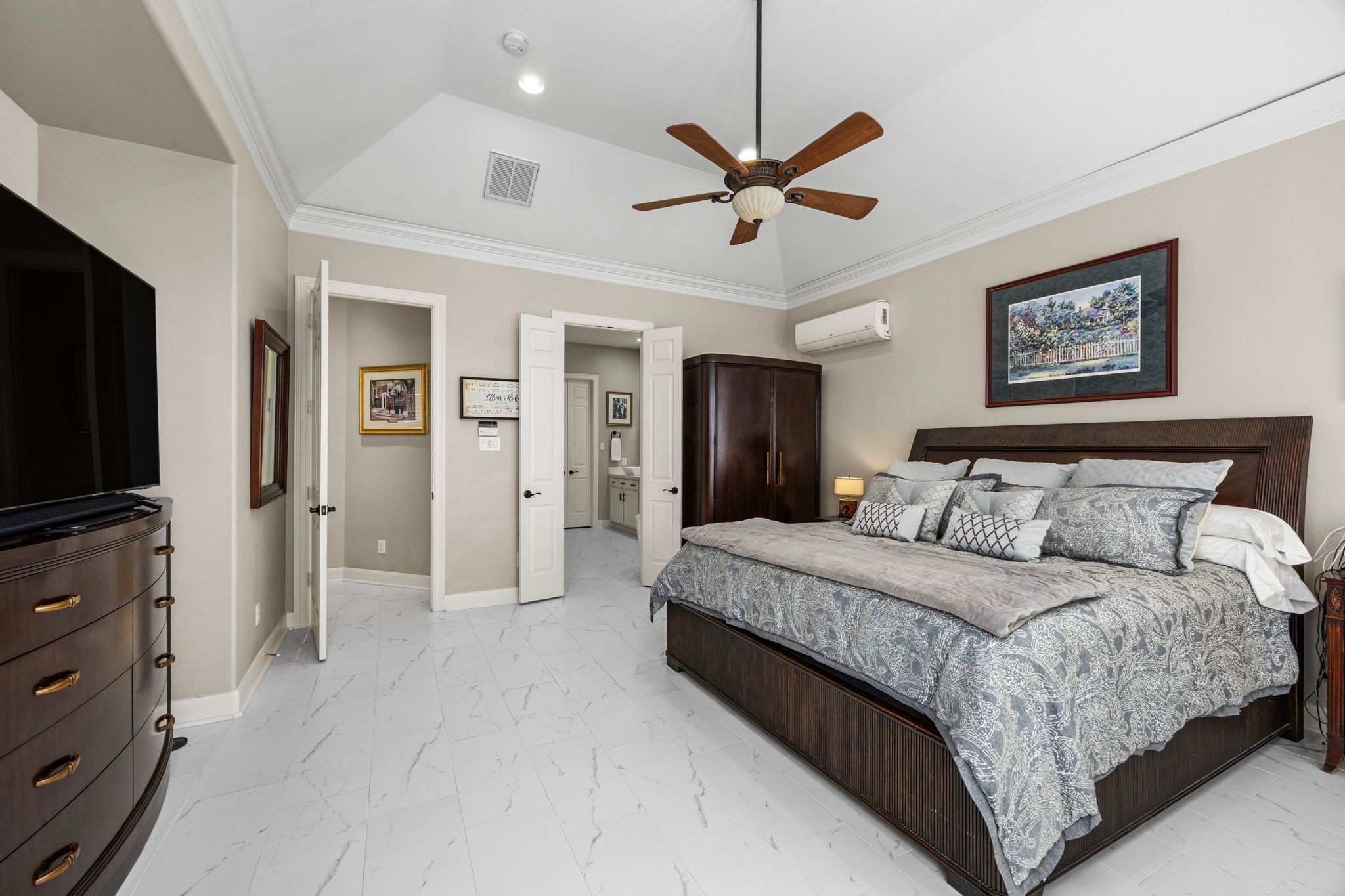 11413 Gallant Ridge Lane Houston, TX 77082 - Photo 24 of 48 a spacious bedroom with a bed and a flat screen tv