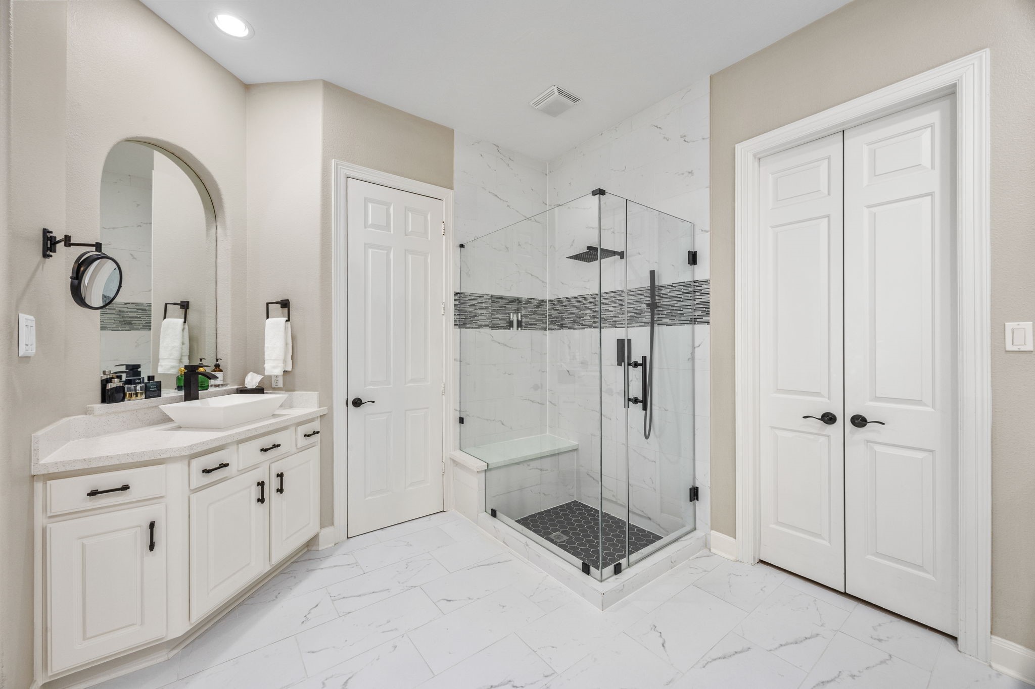 11413 Gallant Ridge Lane Houston, TX 77082 - Photo 26 of 48 a spacious bathroom with a double vanity sink a mirror and a shower