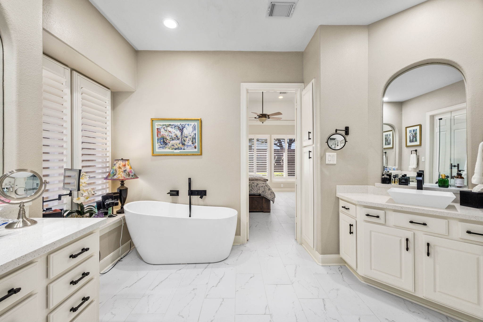 11413 Gallant Ridge Lane Houston, TX 77082 - Photo 27 of 48 a spacious bathroom with a double vanity sink mirror and bathtub