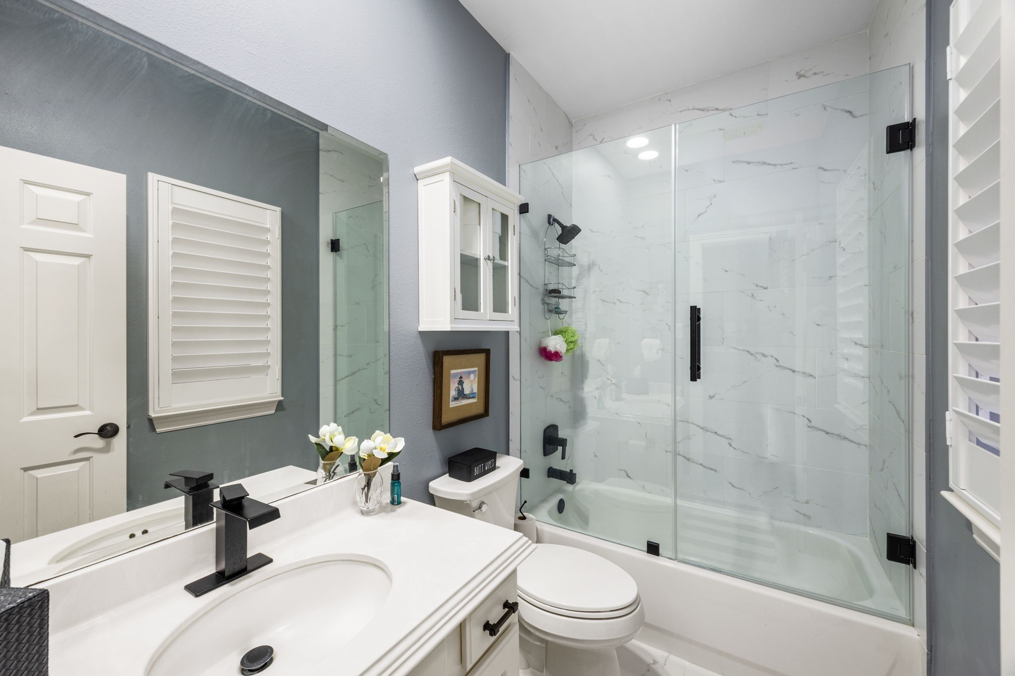 11413 Gallant Ridge Lane Houston, TX 77082 - Photo 30 of 48 a bathroom with a sink a toilet and shower