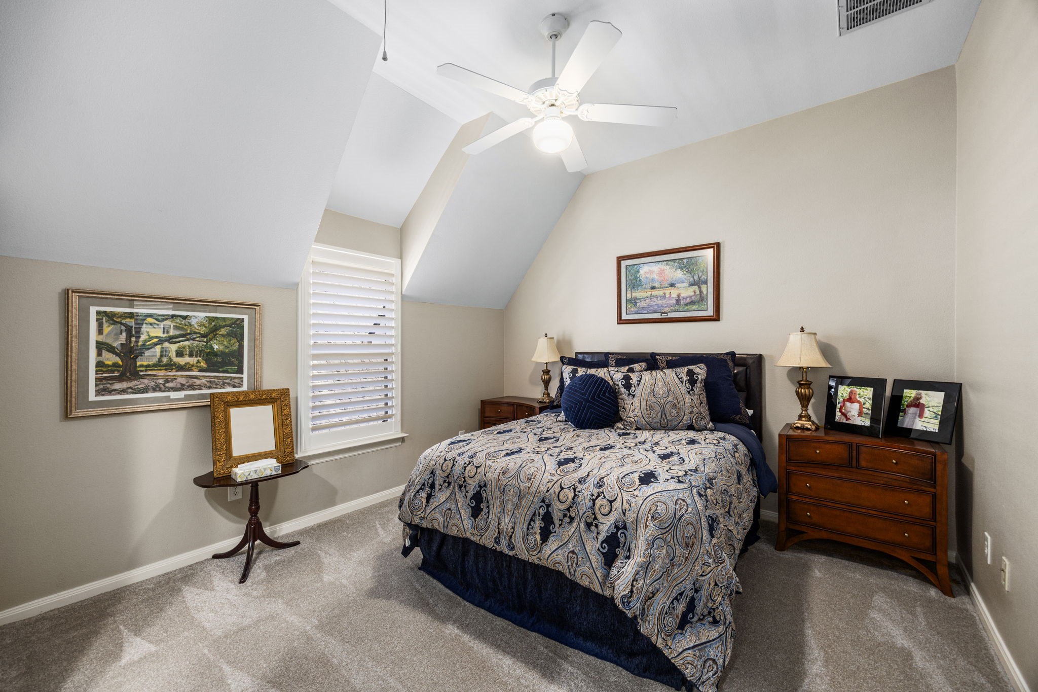 11413 Gallant Ridge Lane Houston, TX 77082 - Photo 37 of 48 a bedroom with a bed and a chandelier