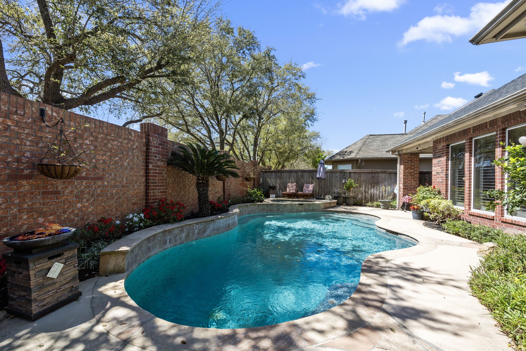 11413 Gallant Ridge Lane Houston, TX 77082 - Photo 46 of 48 a view of a house with backyard sitting area and garden