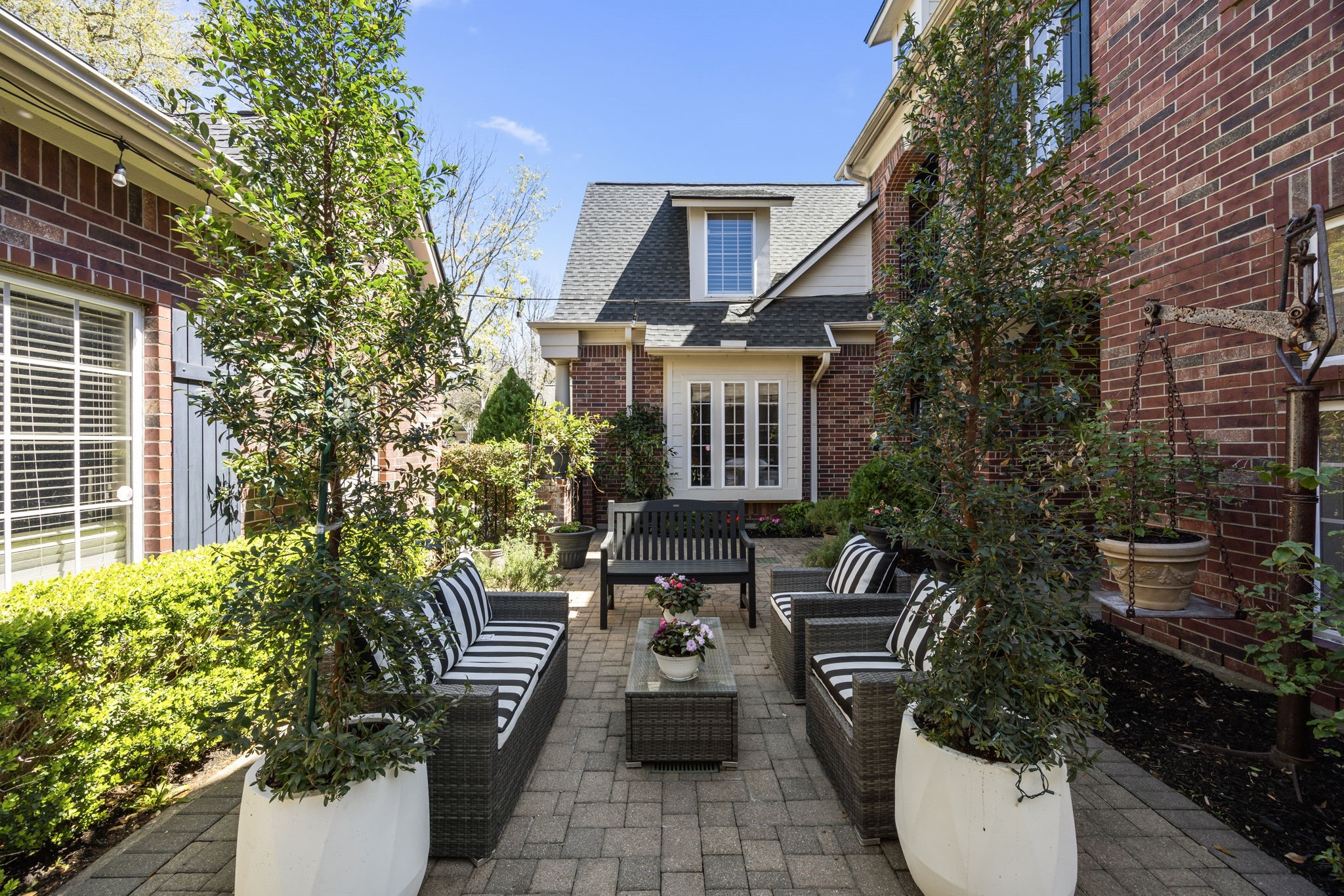 11413 Gallant Ridge Lane Houston, TX 77082 - Photo 7 of 48 a view of a patio with table and chairs and potted plants