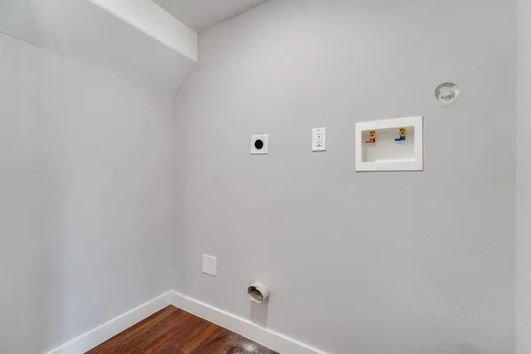 a view of room with hardwood floor and window
