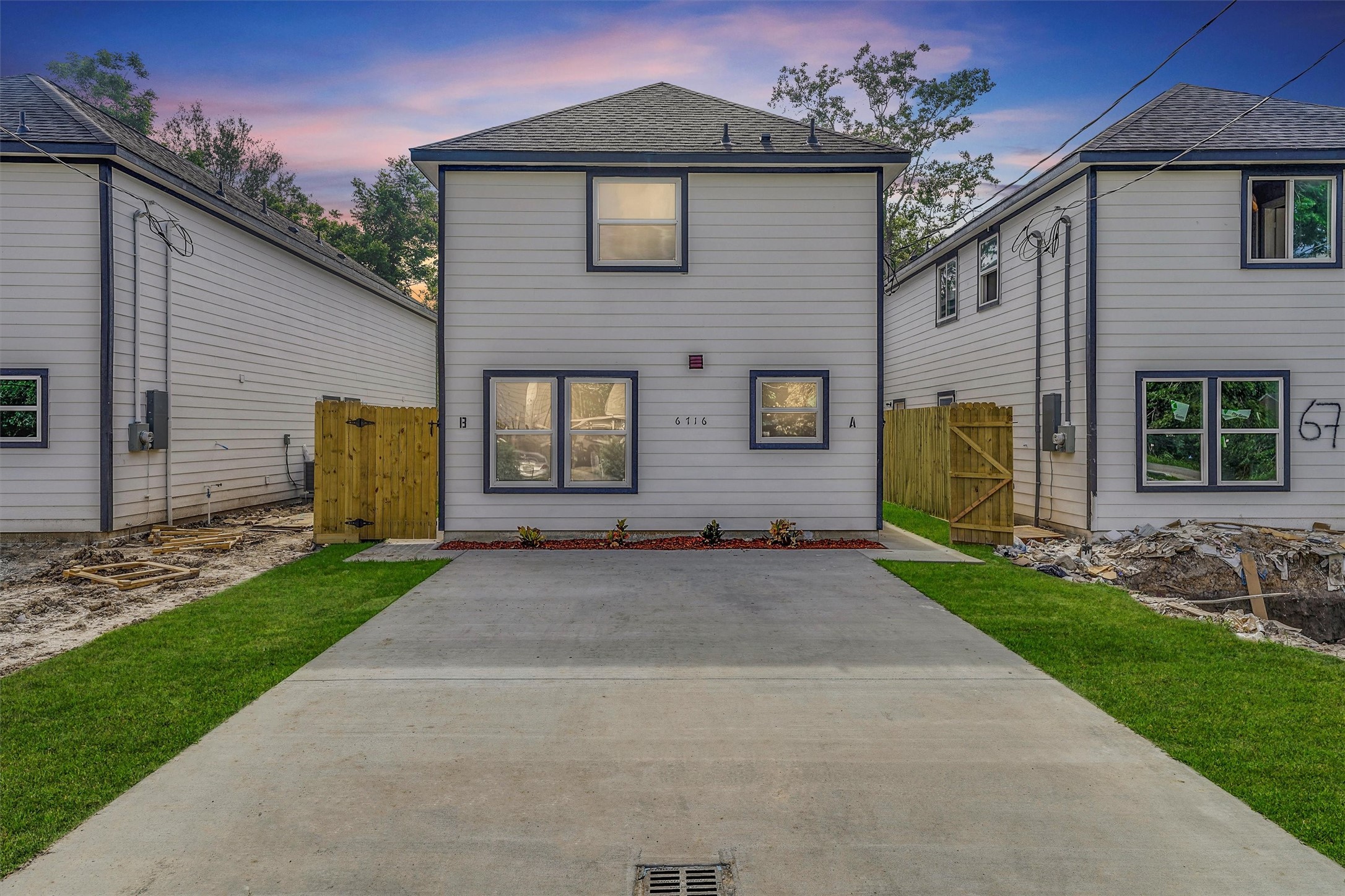 6716 Haight Street, Unit A Houston, TX 77028 - Photo 2 of 14 a front view of a house with a garden and yard