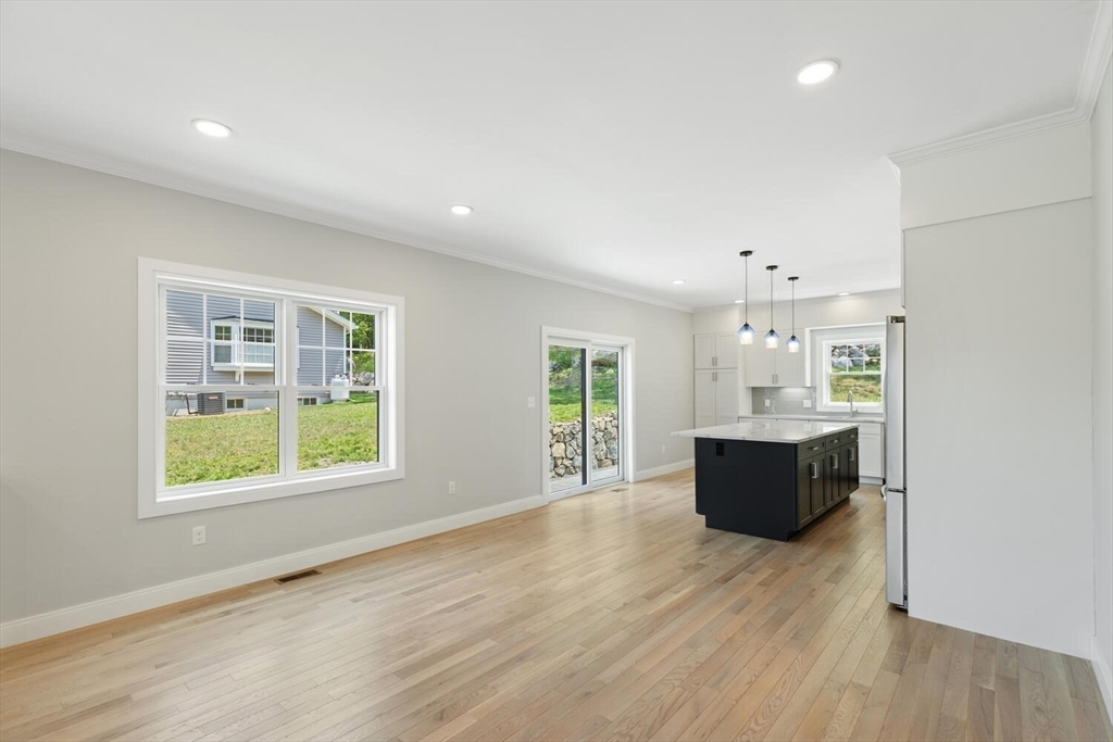 28 Riverview Road, Unit A Gloucester, MA 01930 - Photo 11 of 36 a view of kitchen with window and wooden floor