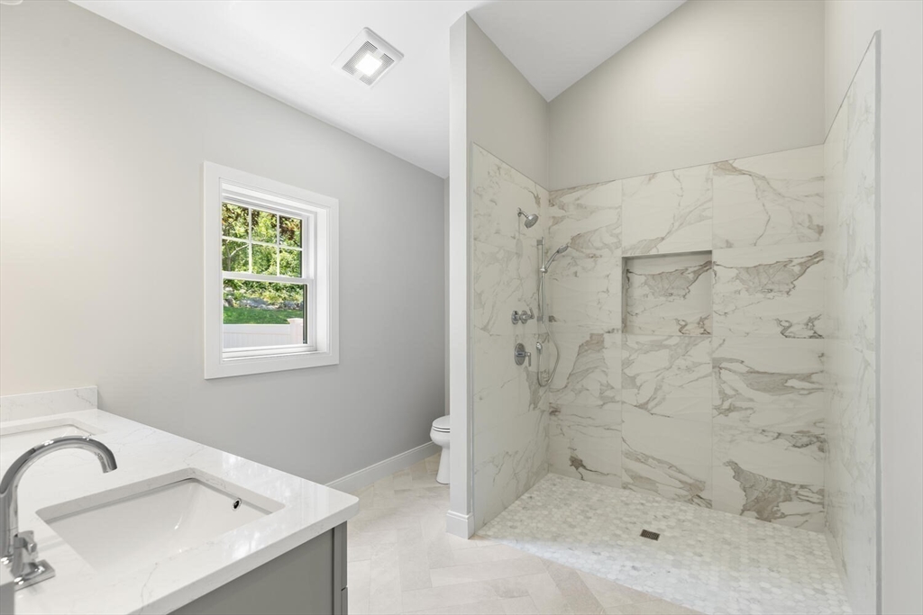 28 Riverview Road, Unit A Gloucester, MA 01930 - Photo 17 of 36 a bathroom with a sink and shower