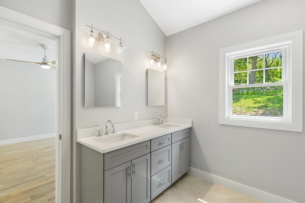 28 Riverview Road, Unit A Gloucester, MA 01930 - Photo 18 of 36 a bathroom with 2 sink and a mirror