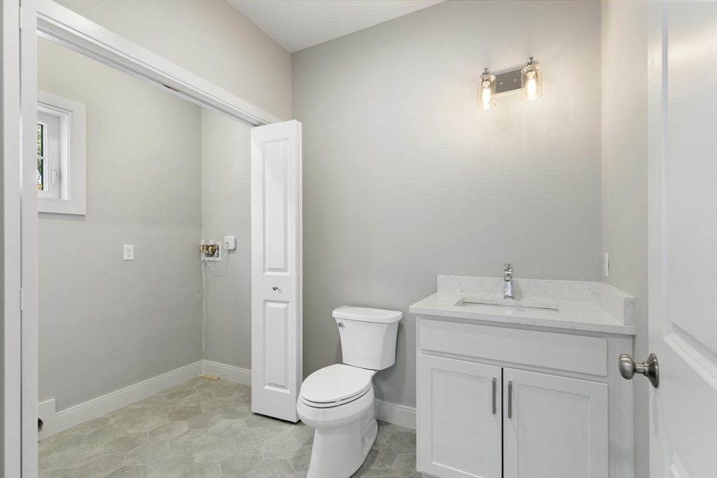 28 Riverview Road, Unit A Gloucester, MA 01930 - Photo 20 of 36 a bathroom with a sink a toilet and shower