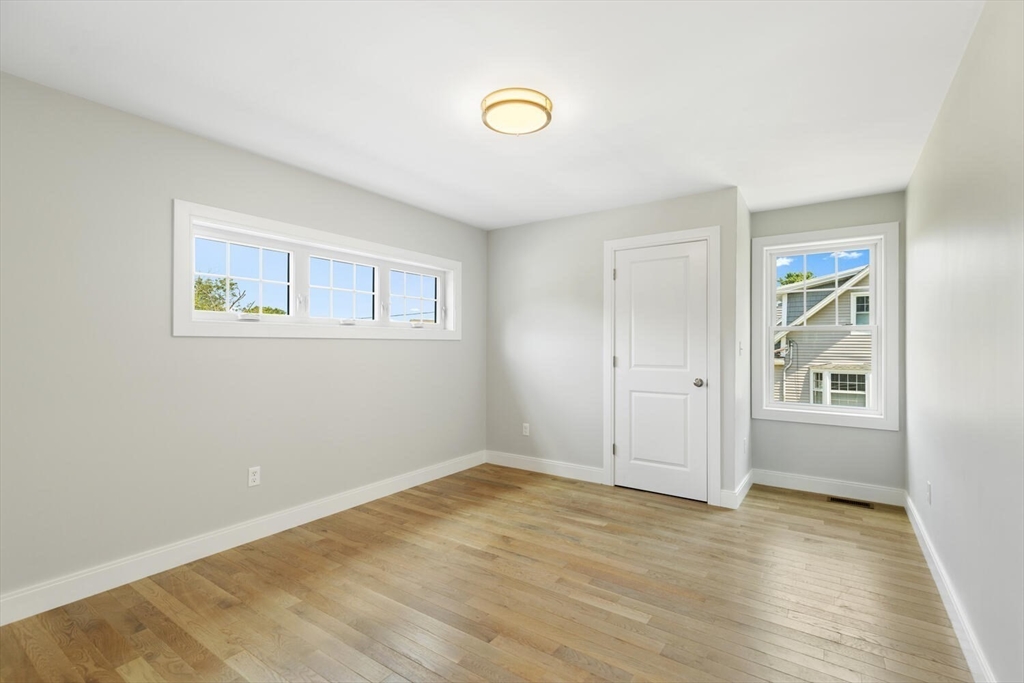 28 Riverview Road, Unit A Gloucester, MA 01930 - Photo 30 of 36 a view of empty room with wooden floor and fan