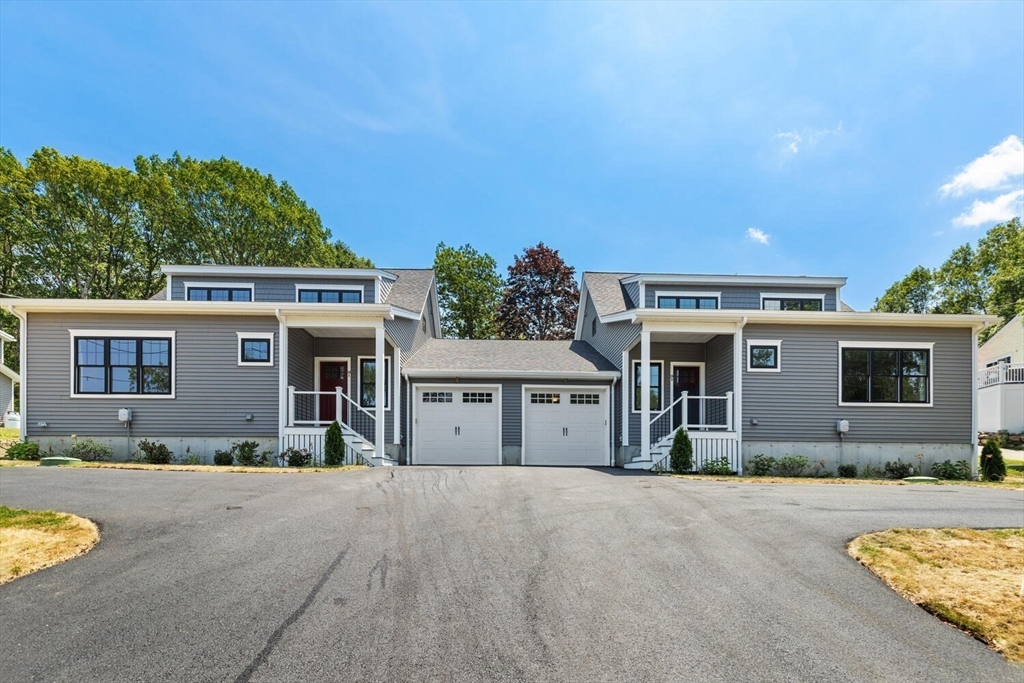 28 Riverview Road, Unit A Gloucester, MA 01930 - Photo 35 of 36 a front view of a house with yard and parking