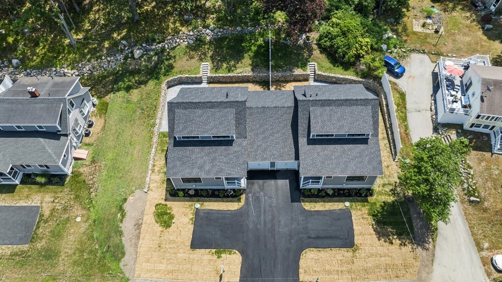 28 Riverview Road, Unit A Gloucester, MA 01930 - Photo 36 of 36 an aerial view of a house with swimming pool and large trees