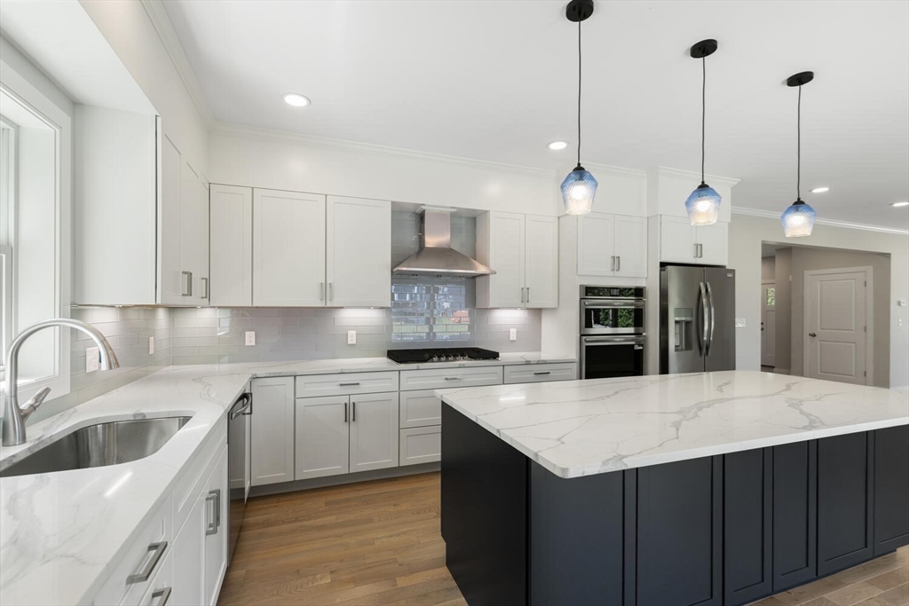 28 Riverview Road, Unit A Gloucester, MA 01930 - Photo 6 of 36 a kitchen with a sink a stove a refrigerator and cabinets